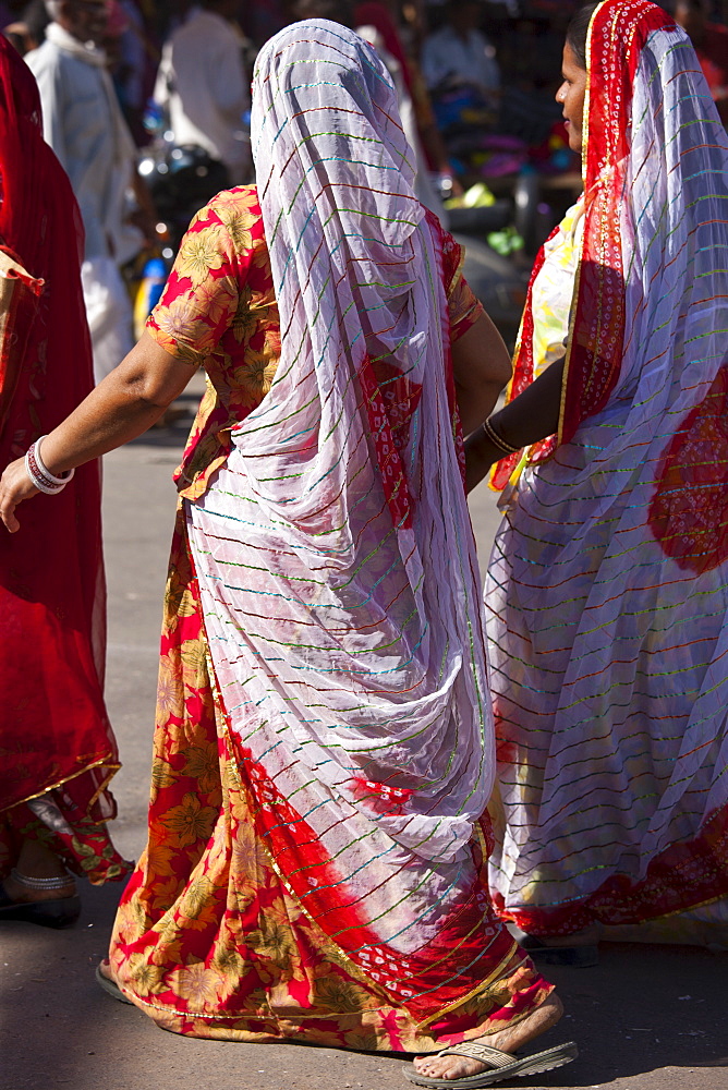 Indian women shopping, street scene at Sardar Market at Girdikot, Jodhpur, Rajasthan, Northern India