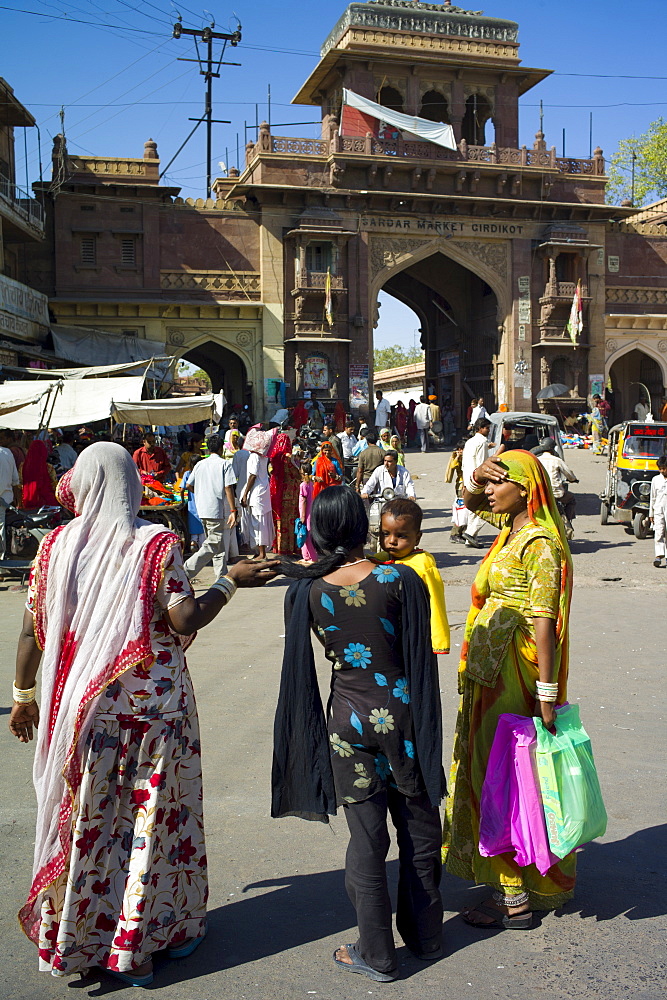 Indian women shopping, street scene at Sardar Market at Girdikot, Jodhpur, Rajasthan, Northern India