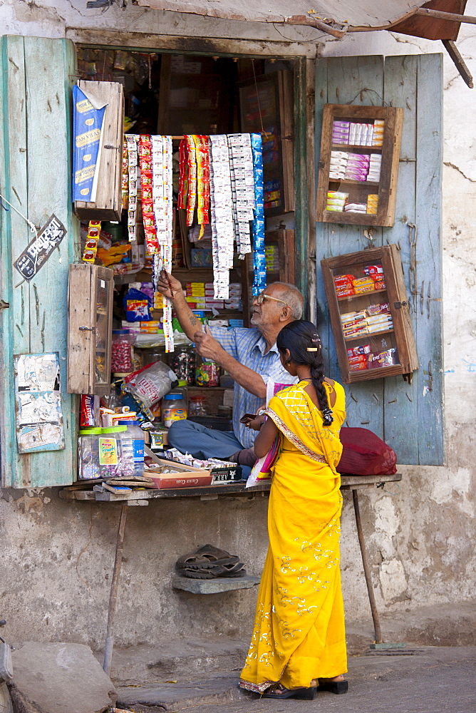 Young Indian woman out shopping in old town Udaipur, Rajasthan, Western India