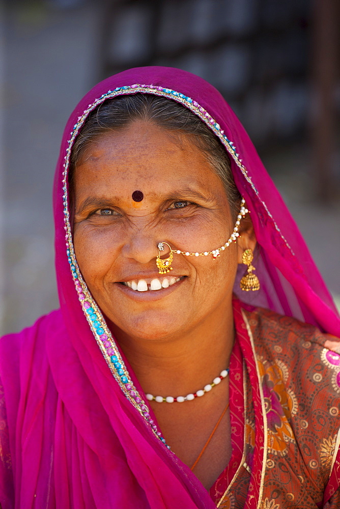 Indian woman with traditional nose jewel in old town Udaipur, Rajasthan, Western India