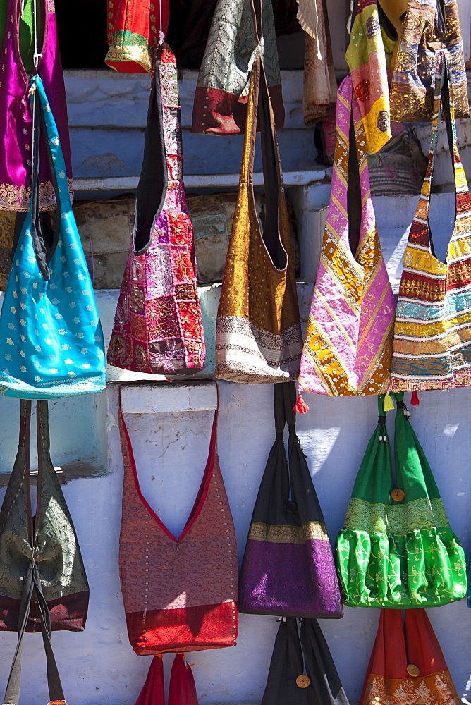 Woven fabric handbags on sale in street market in City Palace Road, Udaipur, Rajasthan, Western India