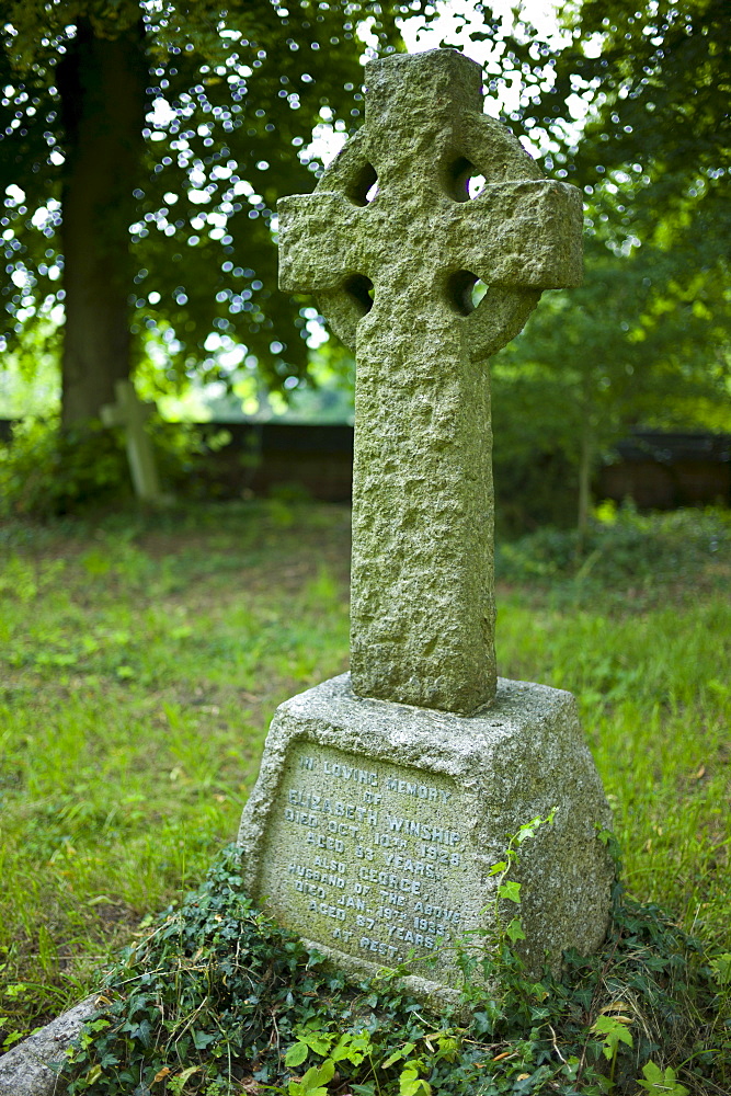 Celtic cross grave for Elizabeth and George Winship in graveyard of St Mary the Virgin Church, Harefield, Middlesex, UK