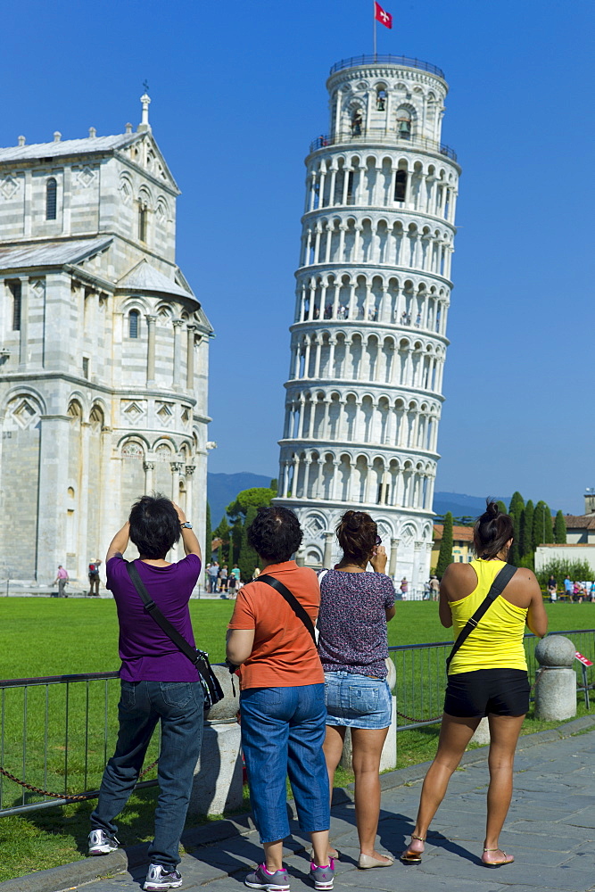 Tourists photographThe Leaning Tower of Pisa, Torre pendente di Pisa, campanile bell tower and Cathedral of Santa Maria, Pisa, Italy