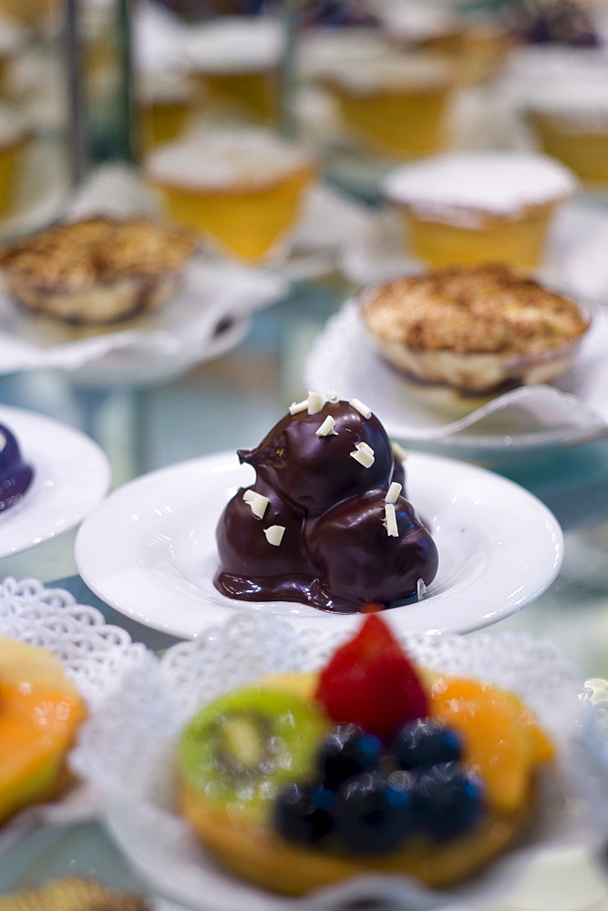 Cakes and pastries in shop window of luxury patticeria, caffe sweet shop Gilli  in Florence, Tuscany, Italy