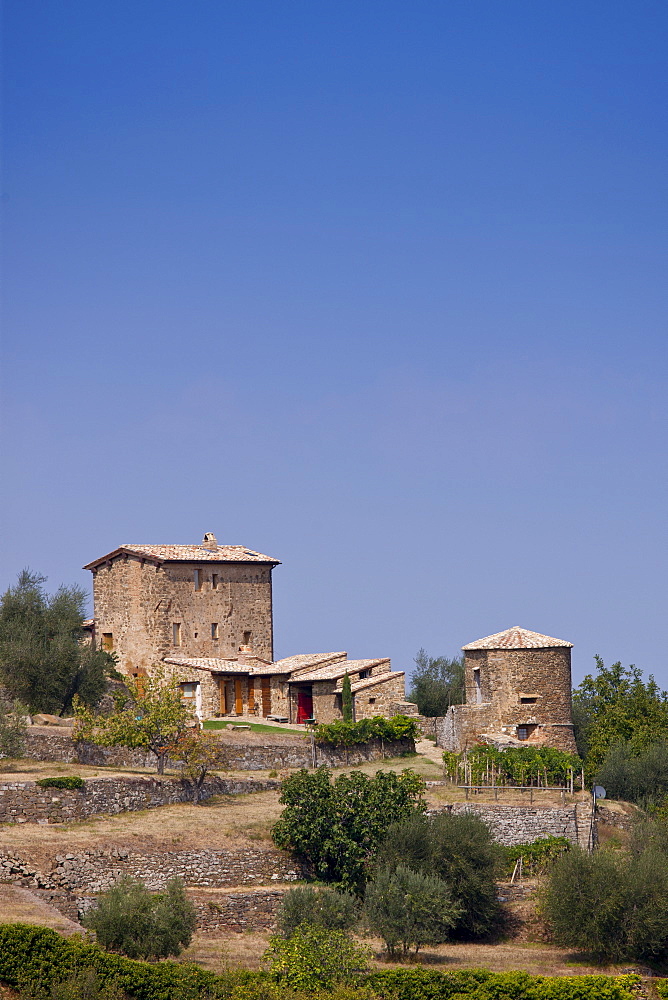 Ancient Tuscan architecture of podere farmhouse near Montalcino in Val D'Orcia, Tuscany, Italy