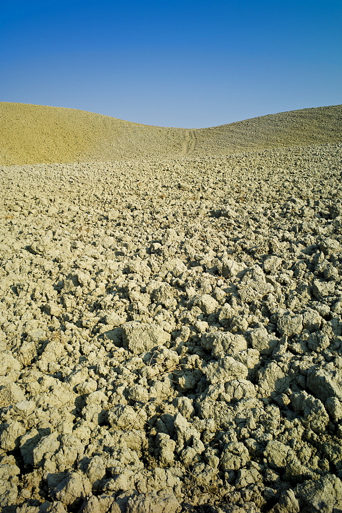 Tuscan parched landscape sun-baked soil  in Val D'Orcia, Tuscany, Italy