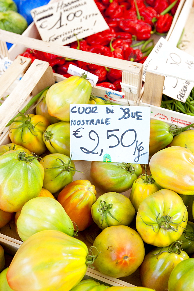 Fresh tomatoes, cuor di bue nostrale, on sale at weekly street market in Panzano-in-Chianti, Tuscany, Italy