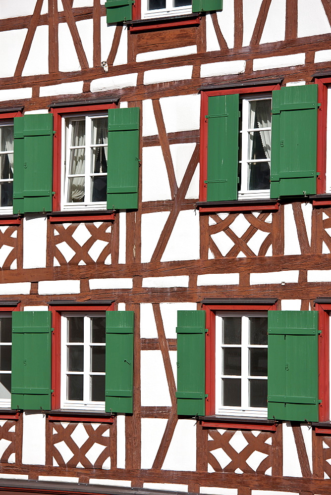 Windows and wooden shutters of quaint timber-framed house in Schiltach in the Bavarian Alps, Germany