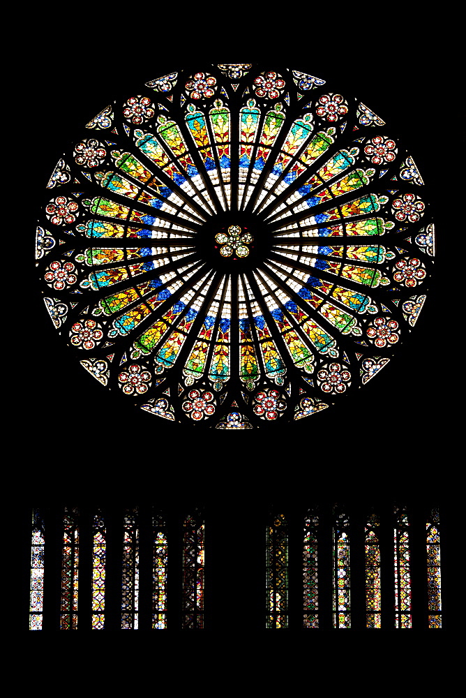 Circular stained glass window in The Cathedral of Notre Dame, Our Lady,  at Strasbourg, Alsace, France