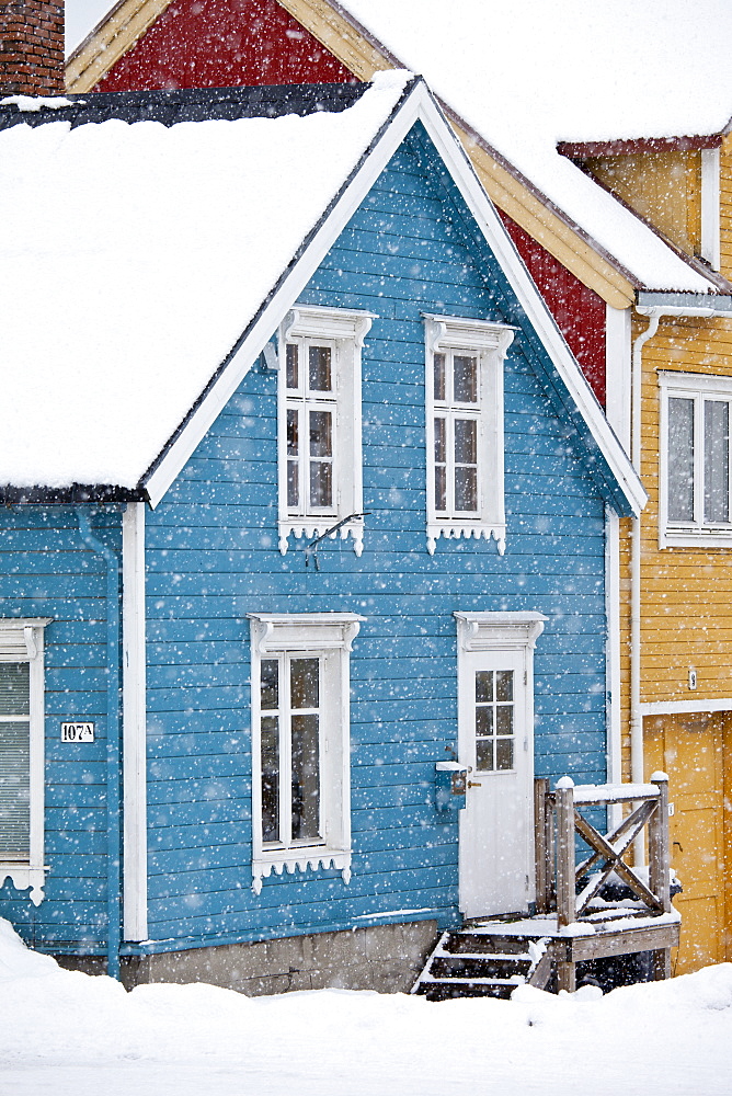 Traditional architecture wooden buildings along Storgata in the quaint area of the city of Tromso, in the Arctic Circle in Northern Norway