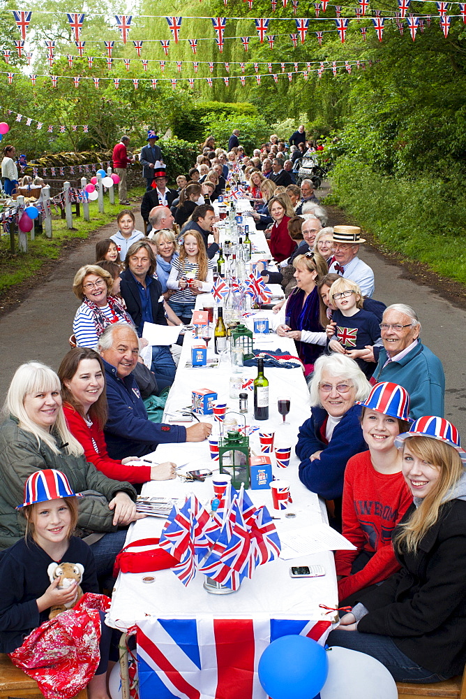 Street party with Union Jack flags and bunting to celebrate Queen's Diamond Jubilee at Swinbrook in The Cotswolds, UK