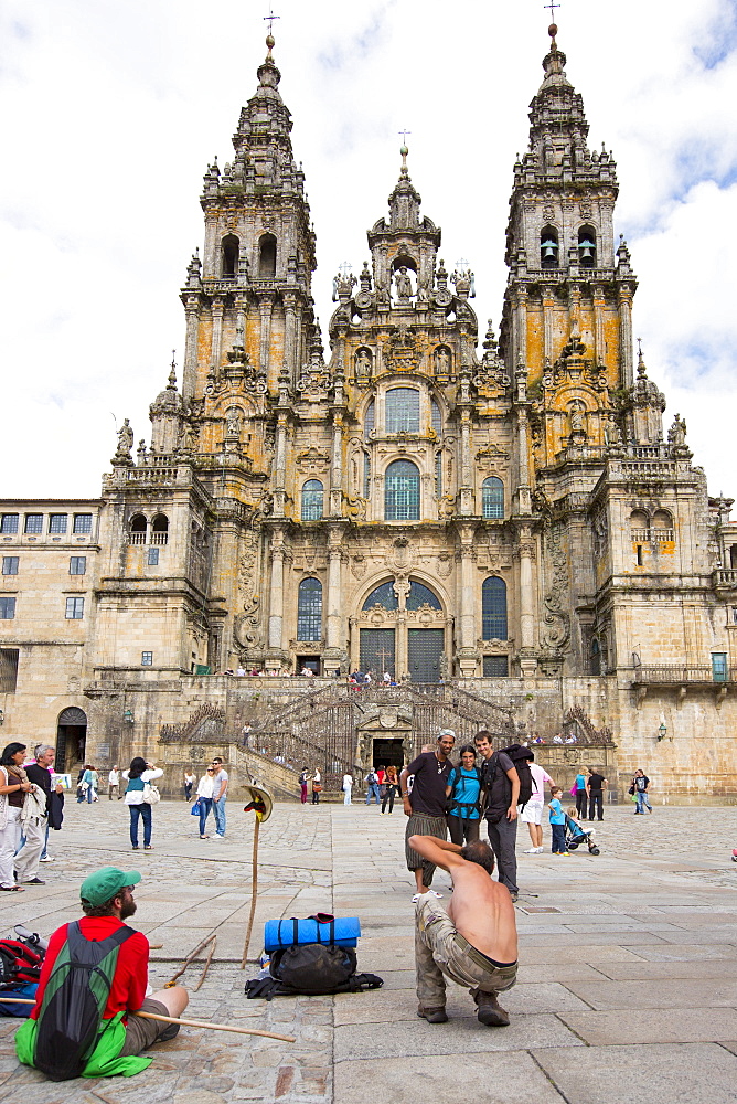 Pilgrims and tourists  in Praza da Obradoiro by Baroque style cathedral, Catedral de Santiago de Compostela, Galicia, Spain