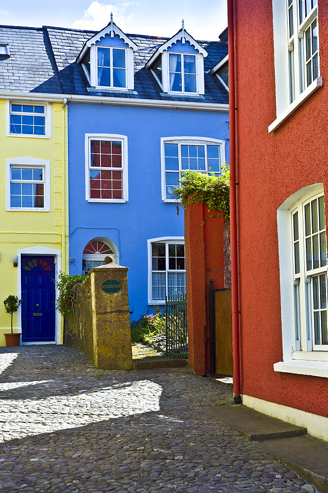 Brightly coloured houses in cobbled alleyway in Kinsale, County Cork, Ireland