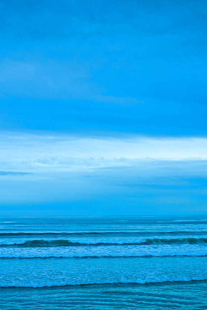 The surf at high tide at the beach resort of Lahinch (Lehinch) at twilight, County Clare, West Coast of Ireland