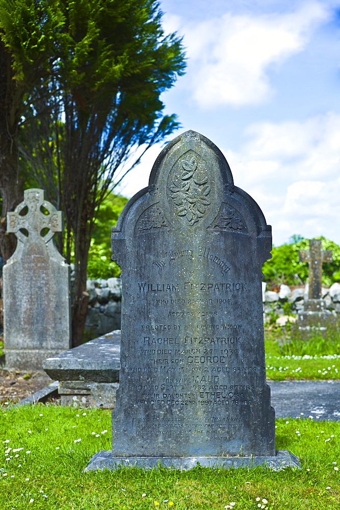 Gravestone of William Fitzpatrick and his family in churchyard at Corofin, County Clare, West of Ireland