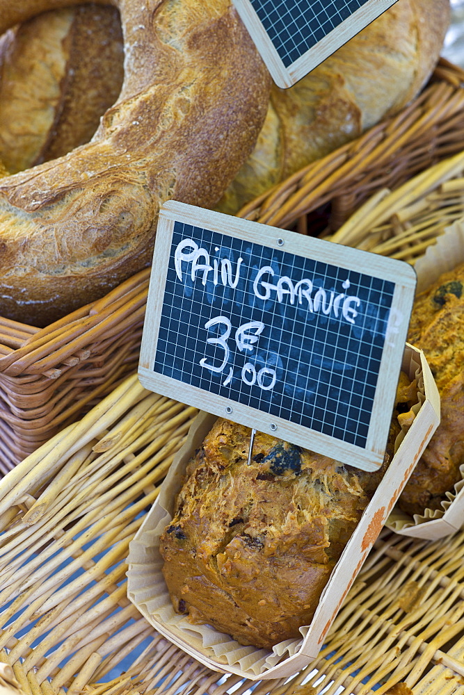 Fresh French bread, pain garnie, on sale for 3 euros at food market at La Reole in Bordeaux region of France