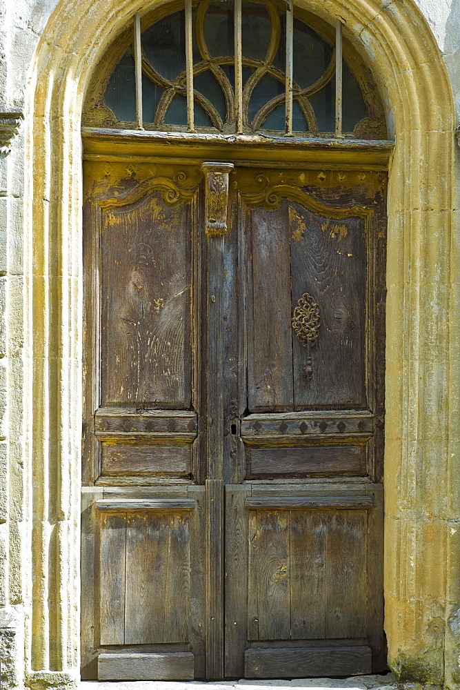 Traditional French doorway in quaint town of Castelmoron d'Albret in Bordeaux region, Gironde, France