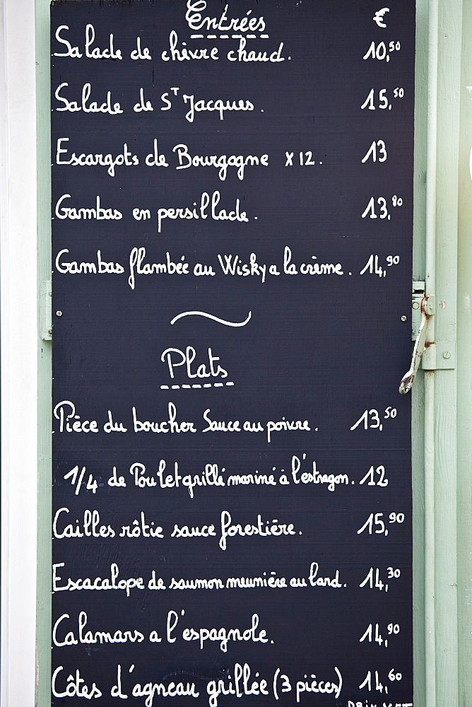 Traditional French Cafe menu of Entrees and Plats in quaint town of Castelmoron d'Albret in Bordeaux region, Gironde, France