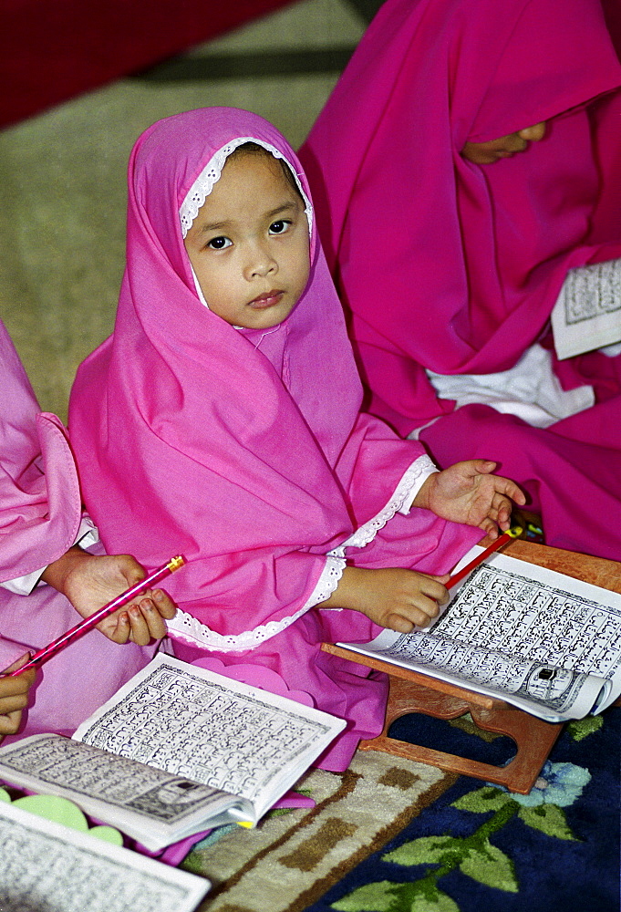 Girls and women studying the Koran at the madrassa at the Jame'asr Hassanal Bolkiah Mosque in Brunei Darussalam