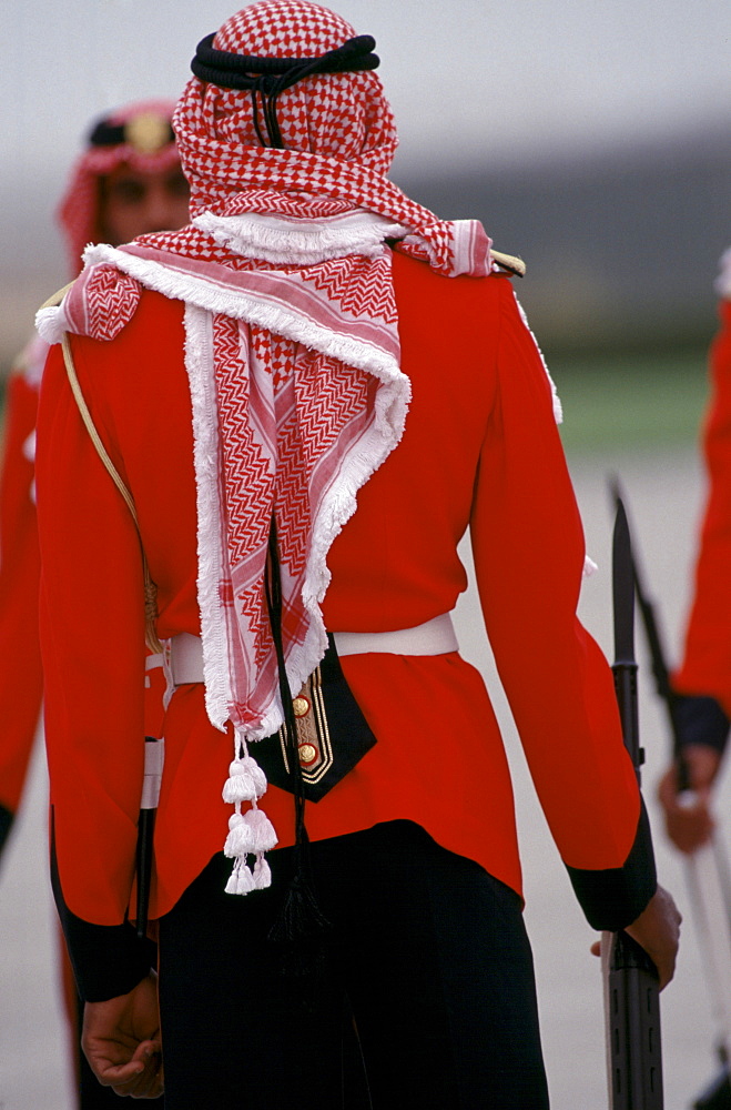 Military armed guard in ceremonial uniform with keffiyeh headdress for VIP arrival at Dubai International airport