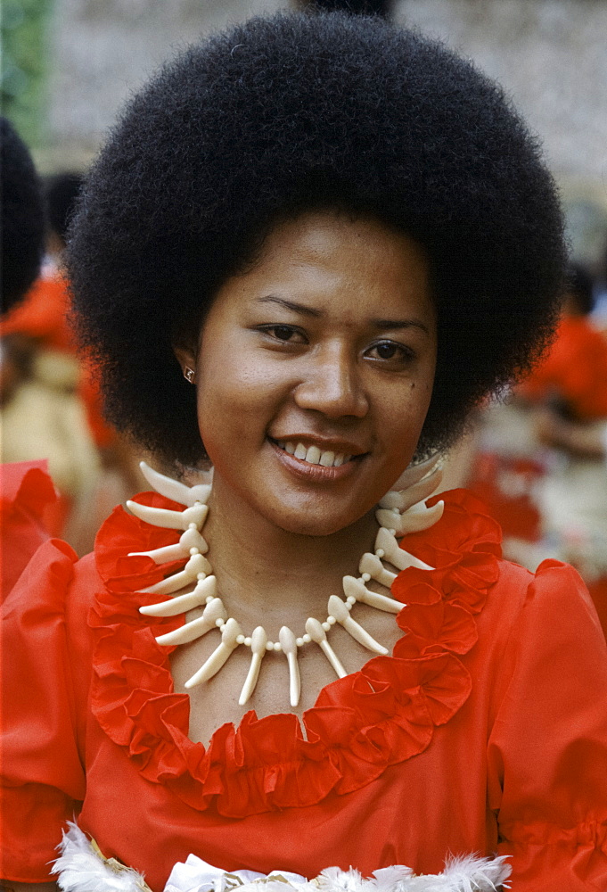 Fijian girl in traditional costume with bone necklace during native ceremony at tribal gathering in Fiji, South Pacific