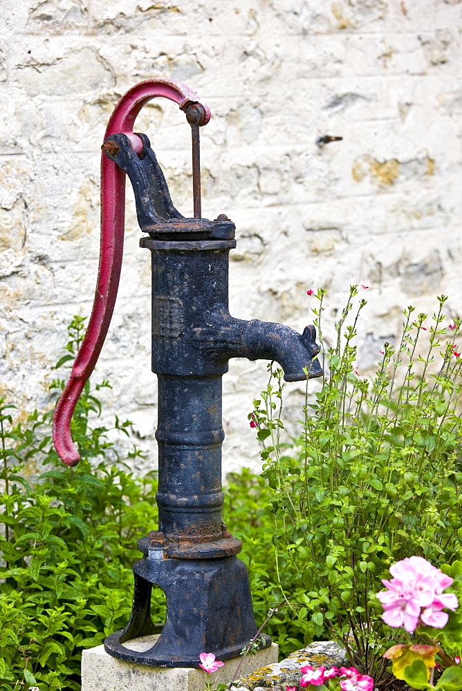 Old village water pump in Normandy, France