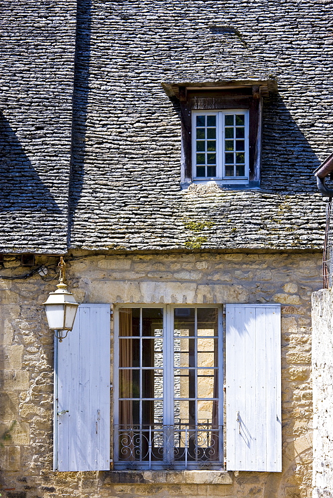 Traditional French window with shutters in Sarlat in the Dordogne, France