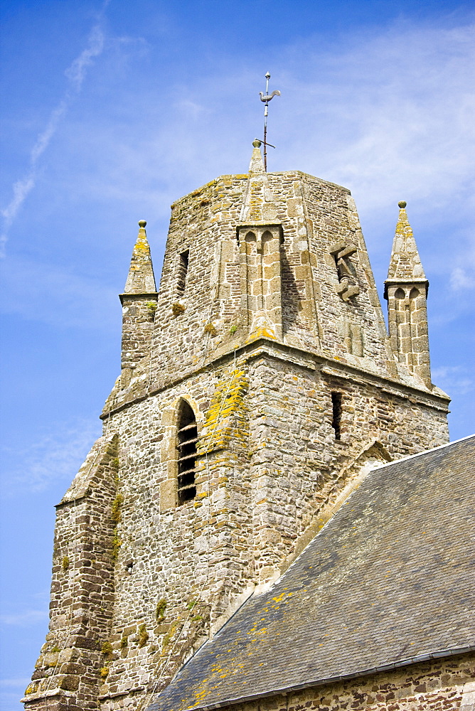 Norman church with unusual rounded square tower in Regneville-Sur-Mer in Normandy, France