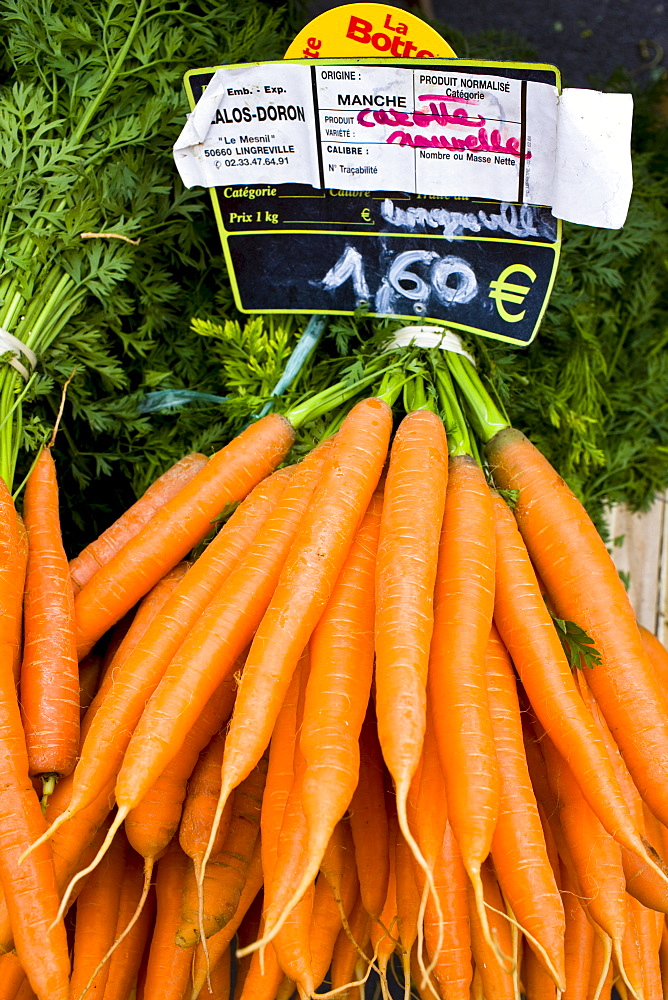 Local produce carrots on sale at farmers market in Normandy, France