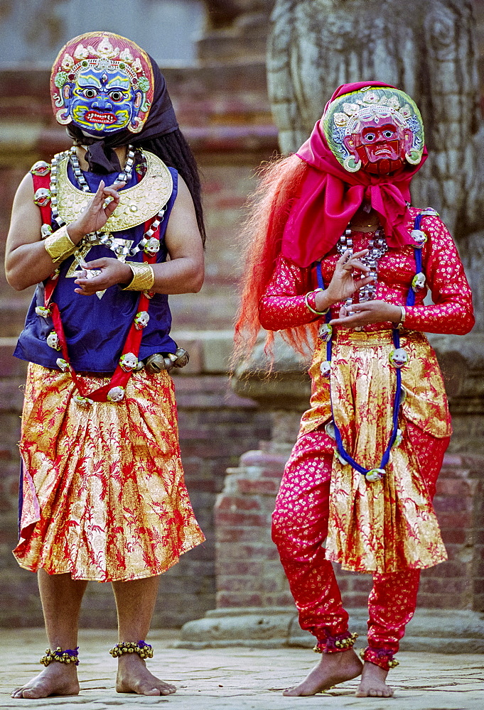 Male and female dancers at cultural event in Bhaktapur, Nepal