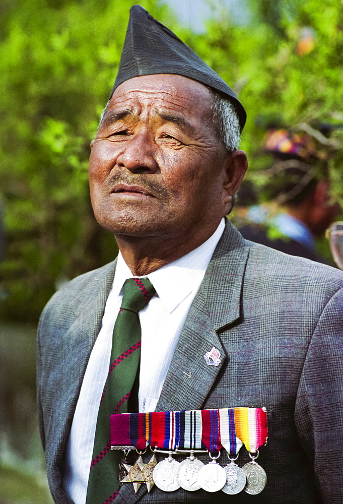 Veteran Ghurka soldier with his war medals proudly displayed in Nepal