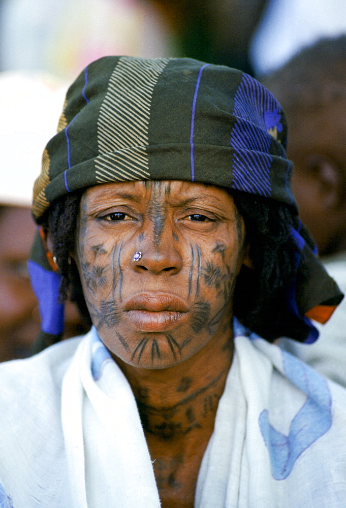 Nigerian local with face markings at tribal gathering cultural event in Nigeria, West Africa