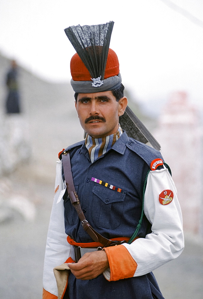 Pakistani soldier in traditional uniform of Kyber Rifles at Khyber Pass border with Afghanistan near Peshawar, Pakistan