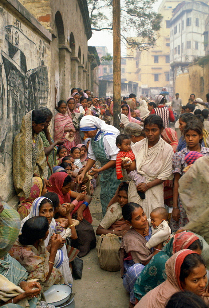 Poor women queuing for food at Mother Teresa's Mission in Calcutta,  India