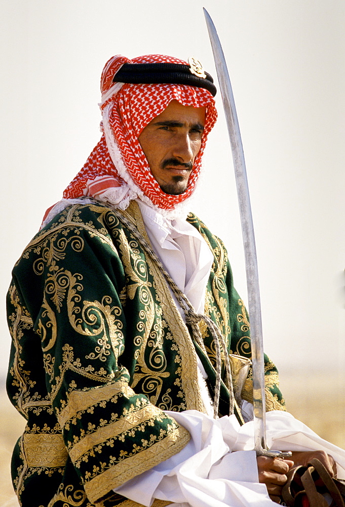 Bedouin on horseback in the desert in Saudi Arabia