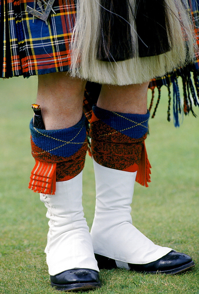 Traditional Scottish kilt and sporran with dirk dagger in sock at the Braemar Royal Highland Gathering, the Braemar Games in Scotland