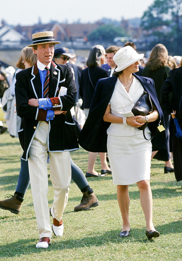 Spectators wearing traditional blazer and boater hat at Henley Royal Yachting Regatta, Henley-on-Thames,UK