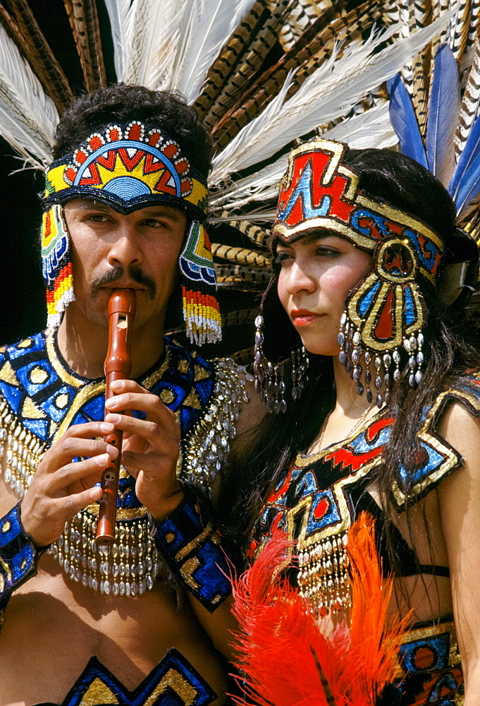 Musicians in Mexican Aztec Indian traditional costumes in Los Angeles, California, USA