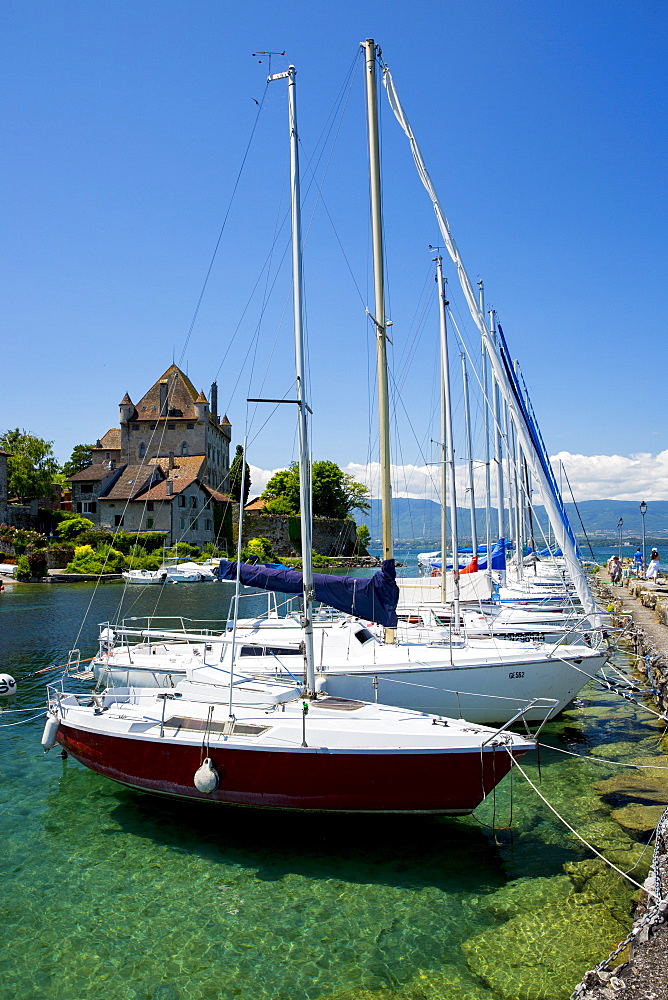 Yachts by the 12th century medieval castle in the old port of Yvoire on Lac Leman (Lake Geneva), Rhone-Alpes, France, Europe