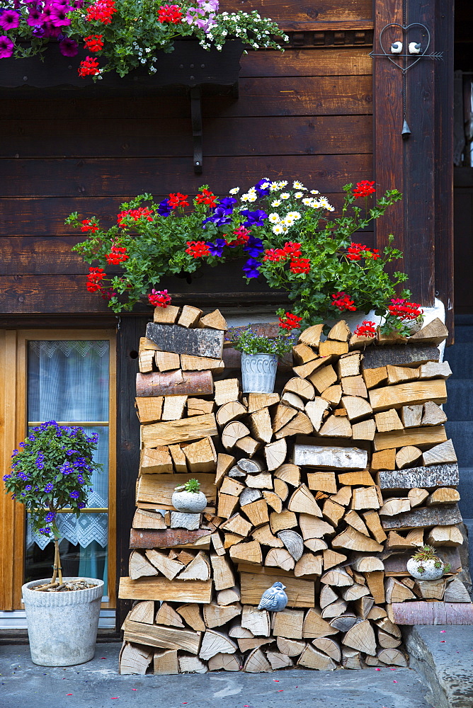 Woodpile at Swiss timber house in 18th century Brunngasse at Brienz in Bernese Oberland, Switzerland, Europe