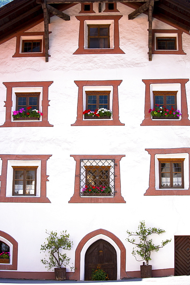 Window detail of traditional old 18th century Tyrolean house in the town of Oetz in the Tyrol, Austria, Europe