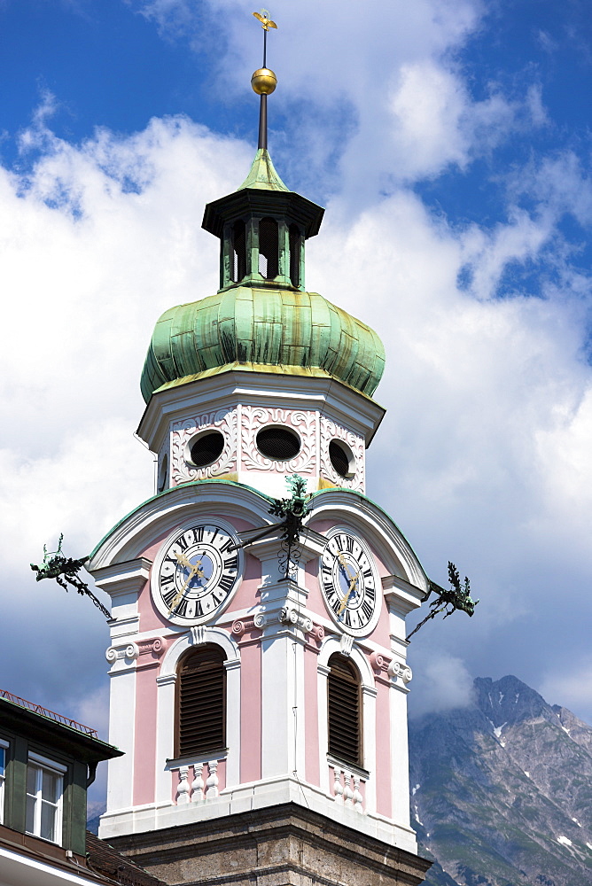 Baroque style 17th century clock tower of Spitalskirche in Maria Theresien Strasse in Innsbruck, the Tyrol, Austria, Europe