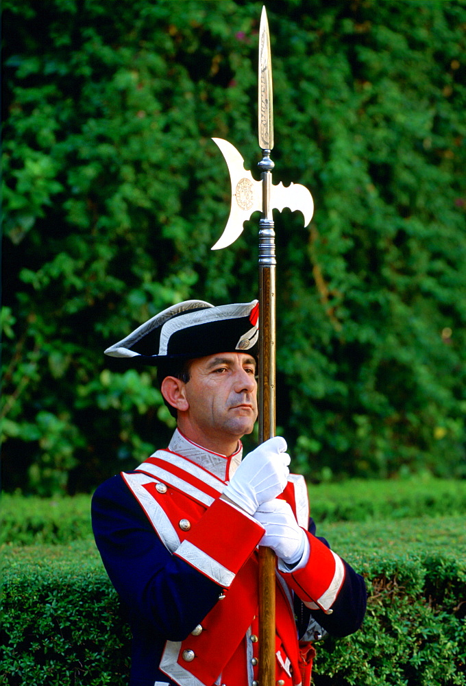 Ceremonial guard with spear at the Alcazar Palace in Seville, Spain