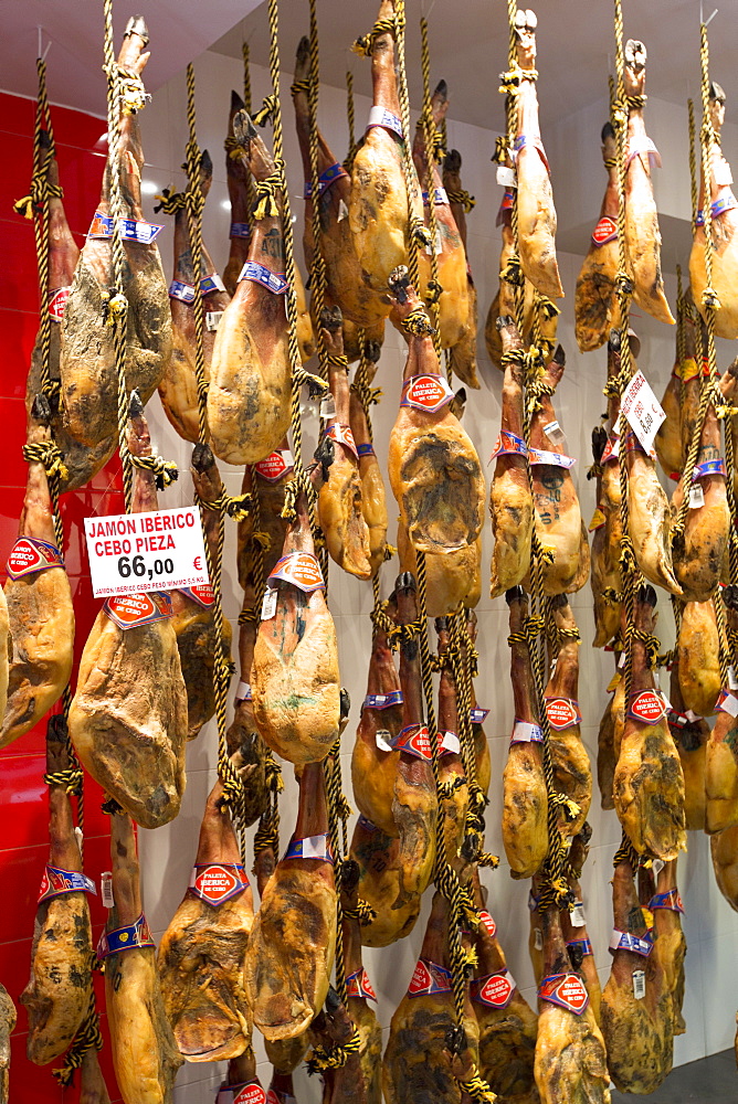 Iberico Ham and other meats on sale in food shop in Calle de Bidebarrieta in Bilbao, Euskadi, Spain, Europe