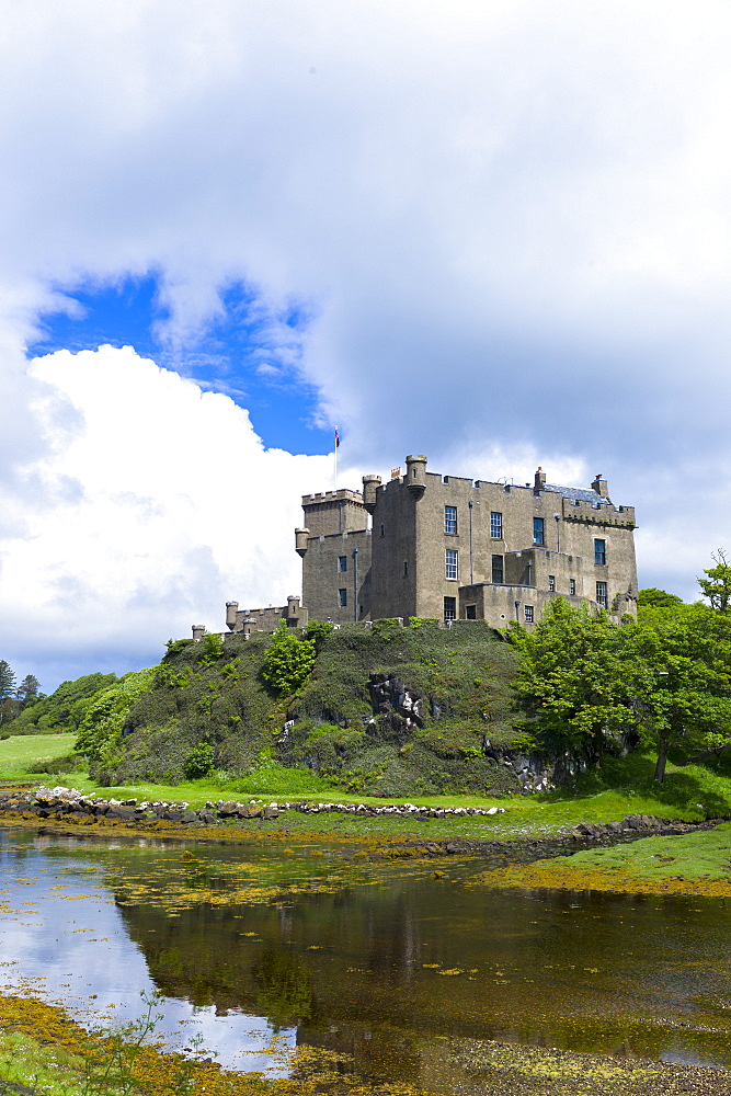 Ancient Highland fortress Dunvegan Castle, the ancestral home of the MacLeod clan, by Dunvegan Loch, a sea loch on the Isle of Skye, Inner Hebrides, Scotland, United Kingdom, Europe