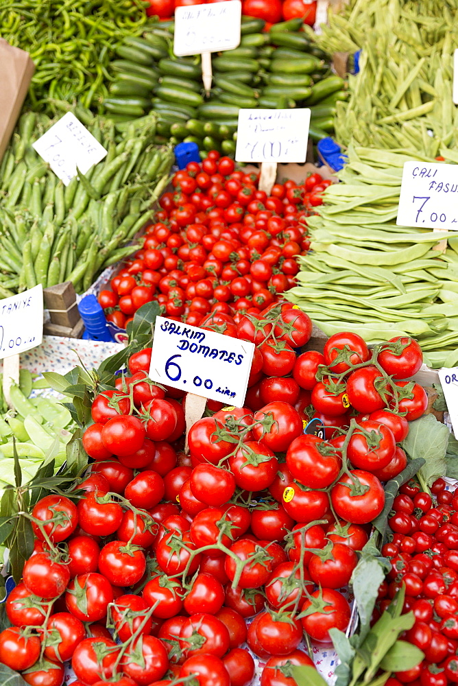 Fresh vegetables, tomatoes, peas and beans for sale at food and spice market in Kadikoy district on Asian side Istanbul, Turkey, Asia Minor, Eurasia