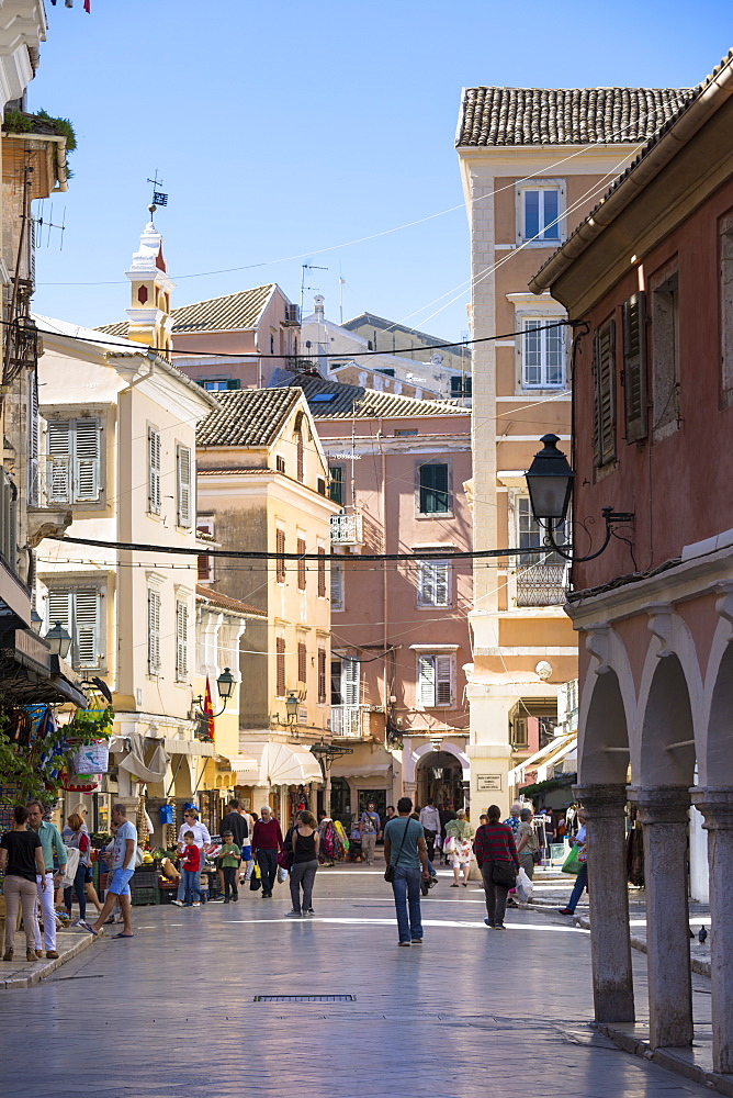 Tourists and local people in street scene in Kerkyra, Corfu Town, Corfu, Greek Islands, Greece, Europe