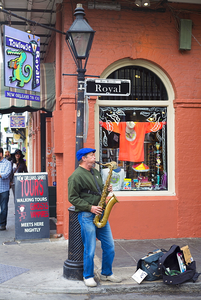 Jazz musician saxophonist plays saxophone in live performance on street corner, Royal Street, French Quarter, New Orleans, USA