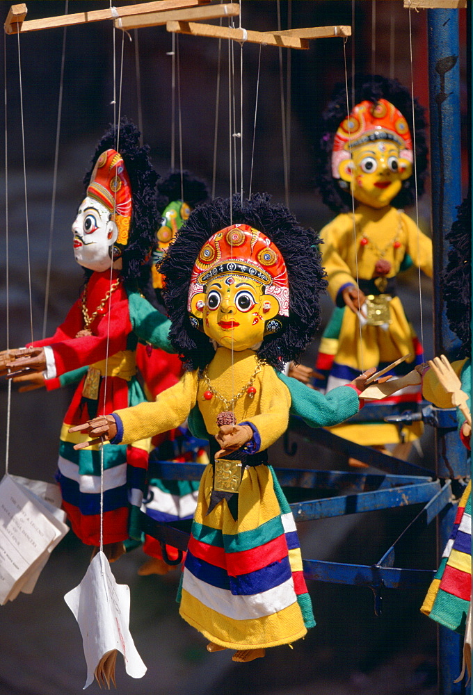 Brightly colored wooden carved puppets-on-strings on sale in the market in Bhaktapur, Nepal