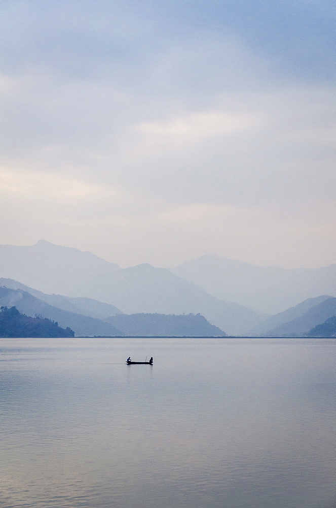 A rowboat on Phewa Tal (Phewa Lake), Pokhara, Nepal, Asia 